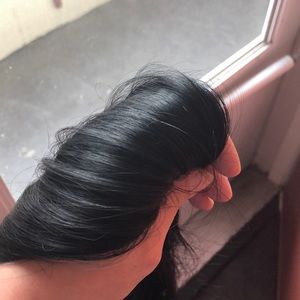 Black clip-in hair extensions